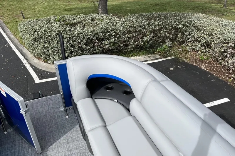 Slide: The Image of 2026 Sun Tracker Party Barge 20 DLX pontoon boat with gray seating and cup holders. - 97