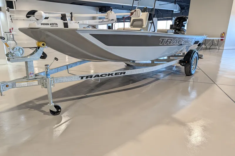 The Image of 2026 Tracker Bass Tracker Classic CC boat on trailer in showroom. - 47