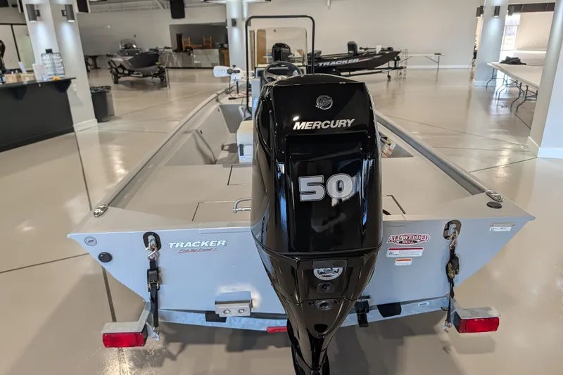 Slide: The Image of 2026 Tracker Bass Tracker Classic CC with Mercury 50 engine in showroom. - 50