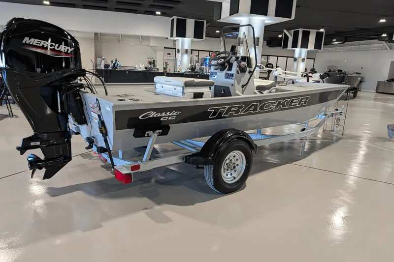 Slide: The Image of 2026 Tracker Bass Tracker Classic CC boat with Mercury engine in showroom. - 51