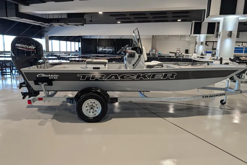 Slide: The Image of 2026 Tracker Bass Tracker Classic CC boat on display indoors. - 52