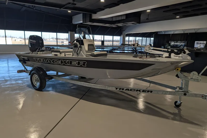 Slide: The Image of 2026 Tracker Bass Tracker Classic CC boat on trailer in showroom. - 53