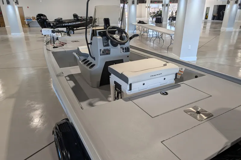 Slide: The Image of 2026 Tracker Bass Tracker Classic CC boat interior in showroom setting. - 55