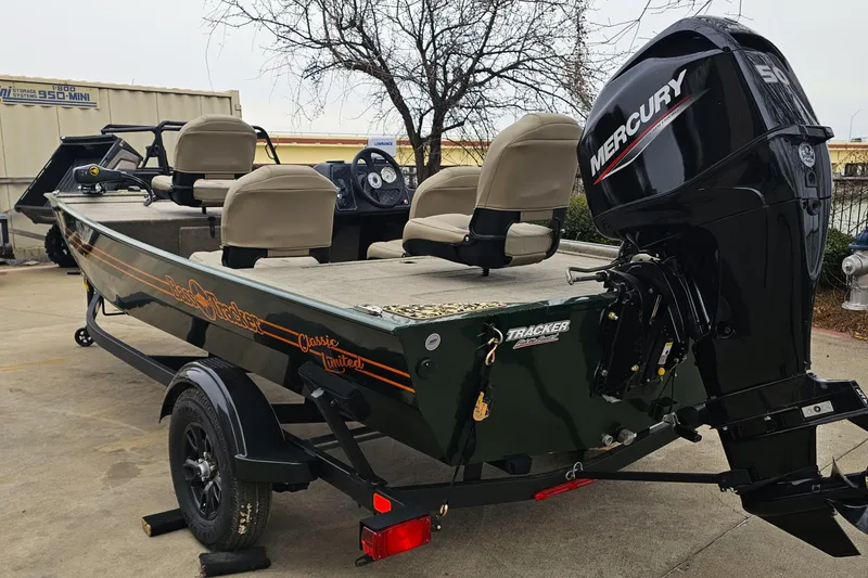 Slide: The Image of 2026 Tracker Bass Tracker Classic Limited boat with Mercury engine on trailer. - 6