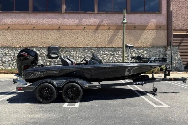 The Image of 2026 Nitro Z18 Pro boat parked in a lot, side view. - 0
