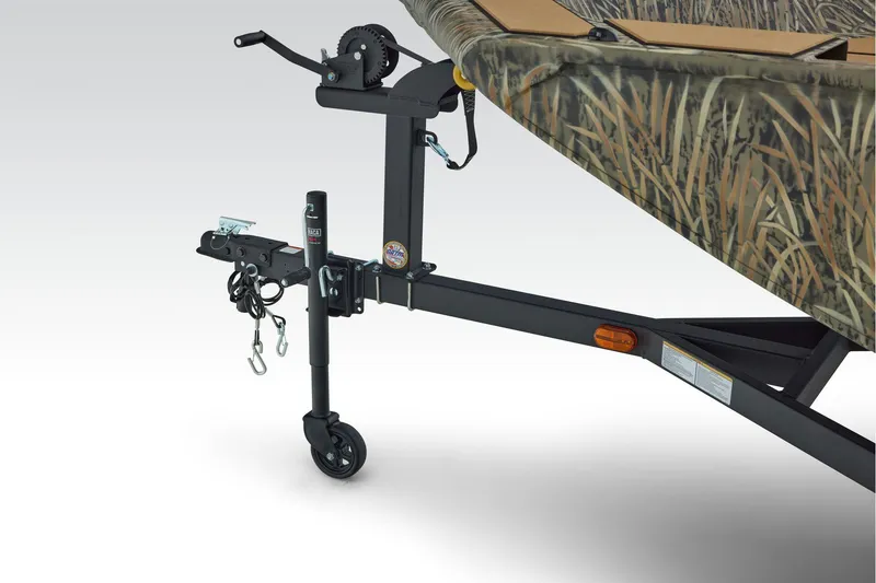 Slide: The Image of 2026 Tracker Grizzly 1756 T Marsh boat interior with tan deck and storage compartments. - 8