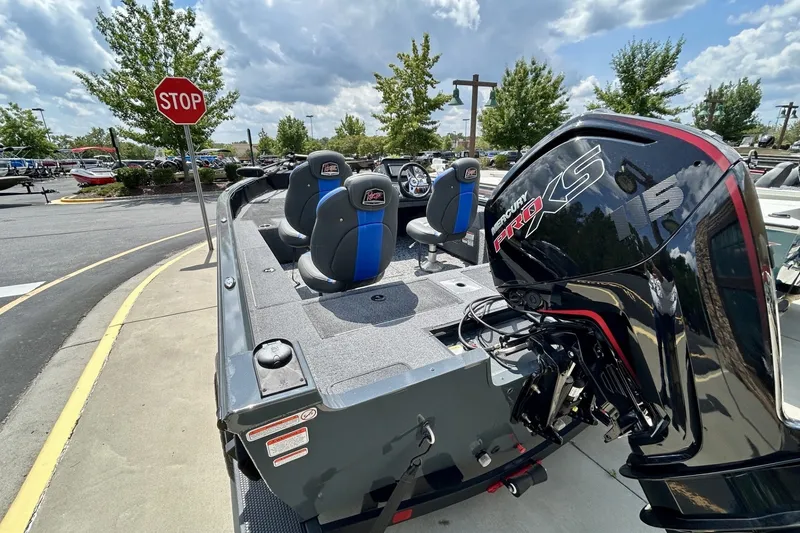 Slide: The Image of 2026 Ranger VS1682SC Angler boat with Mercury Pro XS engine at a parking lot. - 7