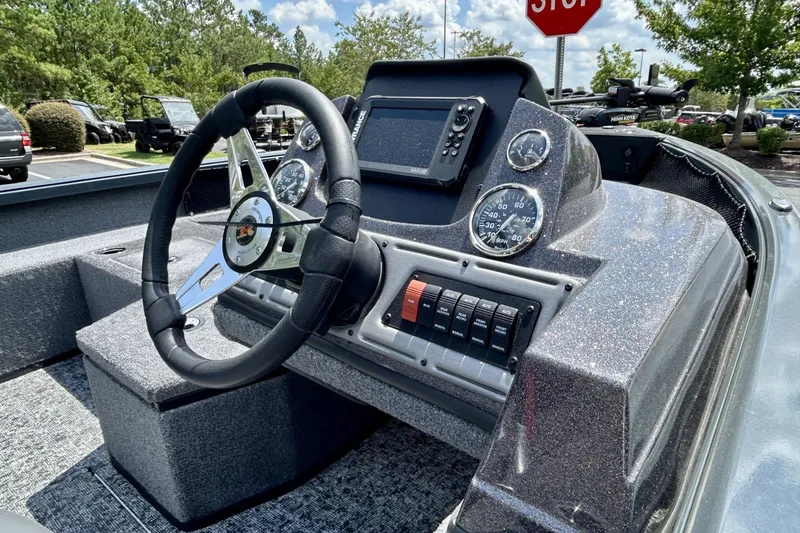 Slide: The Image of 2026 Ranger VS1682SC Angler boat dashboard with steering wheel and control panel. - 1