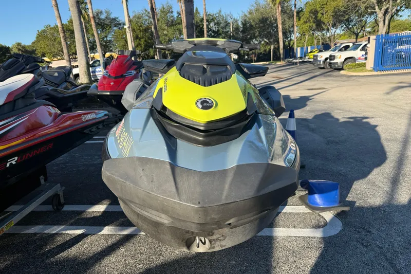Slide: The Image of 2021 Sea-Doo GTI SE 130 jet ski parked outdoors on a sunny day. - 1
