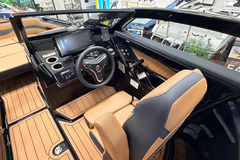 Slide: The Image of 2026 Yamaha Boats 275SD cockpit with modern controls and luxurious seating. - 5