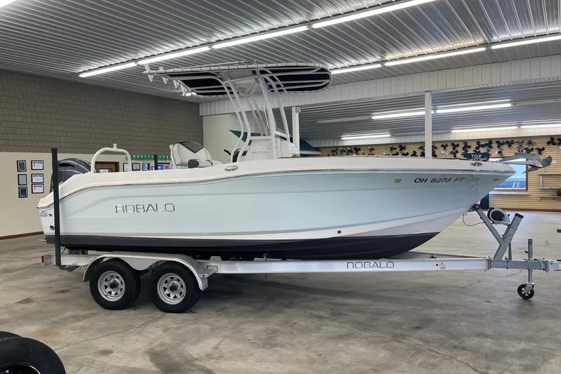 Slide: The Image of 2018 Robalo R200 Center Console boat on trailer in indoor showroom. - 3