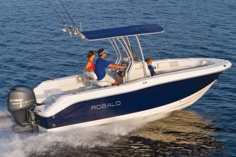 Slide: The Image of Manufacturer Provided Image: 2018 Robalo R200 Center Console boat cruising on water with passengers. - 9