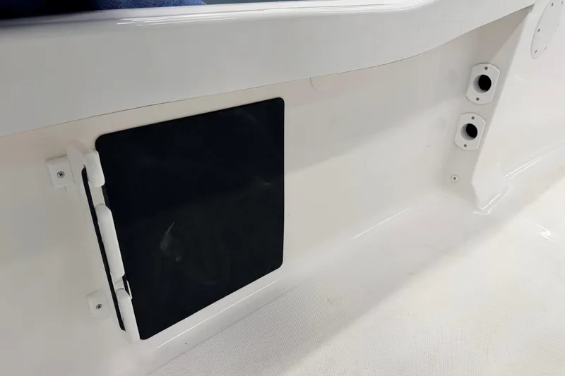 Slide: The Image of 2026 Tidewater 180 CC Adventure boat emblem on white surface. - 15