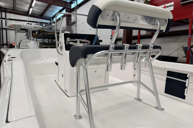 Slide: The Image of 2026 Tidewater 180 CC Adventure boat storage compartment with secure latch. - 17