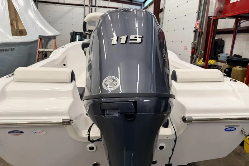 Slide: The Image of 2026 Tidewater 180 CC Adventure boat with Yamaha 115 engine in a garage. - 6