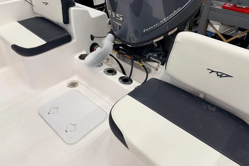 Slide: The Image of 2026 Tidewater 180 CC Adventure boat with Yamaha 115 engine in a garage setting. - 7