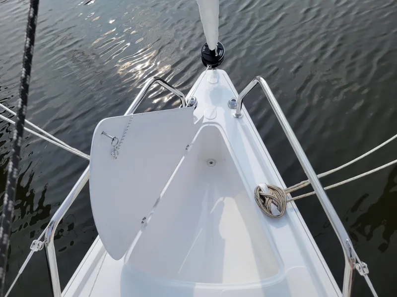 Slide: The Image of 2024 Zonda Z24 Base Model sailboat bow on calm water. - 10