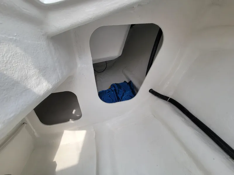 Slide: The Image of Interior view of 2024 Zonda Z24 Base Model, showcasing white cabin space and storage area. - 14