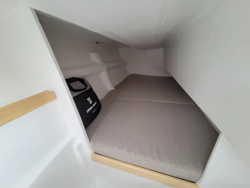 Slide: The Image of 2024 Zonda Z24 Base Model interior cabin with cushioned sleeping area. - 22