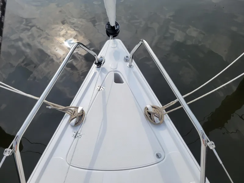 Slide: The Image of Bow of 2024 Zonda Z24 Base Model sailboat with ropes and metal railings. - 9