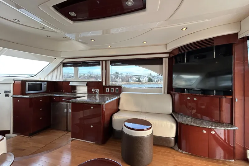 Slide: The Image of Luxurious interior of 2008 Sea Ray 52 Sedan Bridge yacht with modern kitchen and seating area. - 17