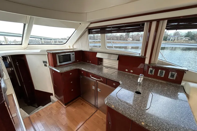 Slide: The Image of Luxurious 2008 Sea Ray 52 Sedan Bridge yacht interior with modern kitchen amenities. - 20