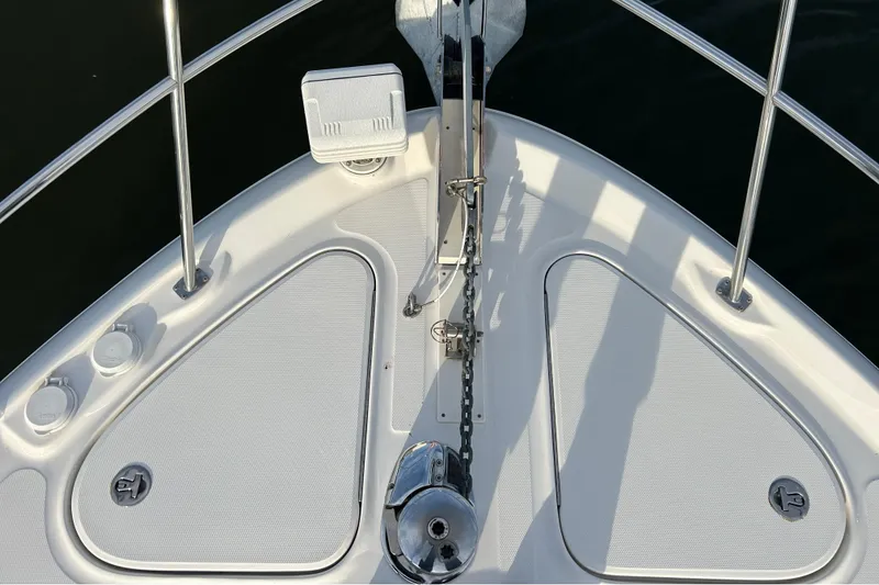 Slide: The Image of Bow view of 2008 Sea Ray 52 Sedan Bridge with anchor and American flag. - 22