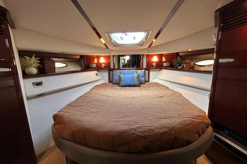 Slide: The Image of Luxurious 2008 Sea Ray 52 Sedan Bridge yacht bedroom with skylight and elegant decor. - 26