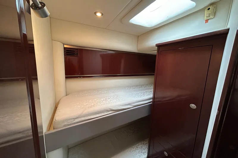 Slide: The Image of Luxurious cabin interior of 2008 Sea Ray 52 Sedan Bridge yacht with elegant wood finish. - 28