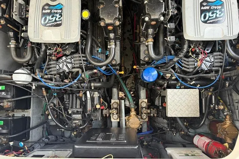 Slide: The Image of Engine compartment of a 2003 Sea Ray 320 Sundancer with twin MerCruiser 350 MAG MPI engines. - 24