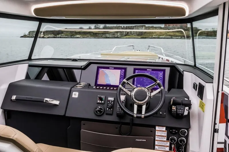 Slide: The Image of Interior view of 2021 Axopar 37 XC Cross Cabin cockpit. - 2