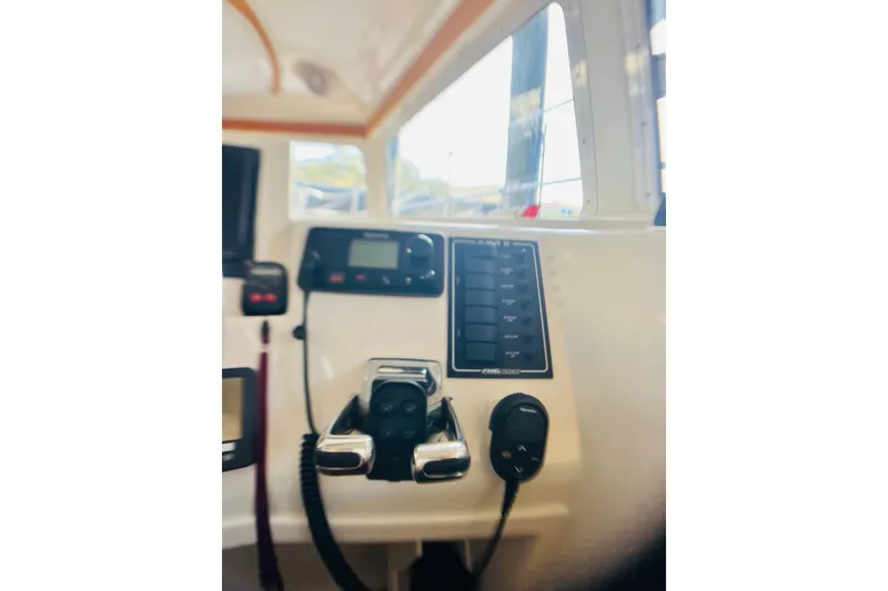 Slide: The Image of Control panel of a 2007 PDQ MV41 boat with navigation equipment. - 11