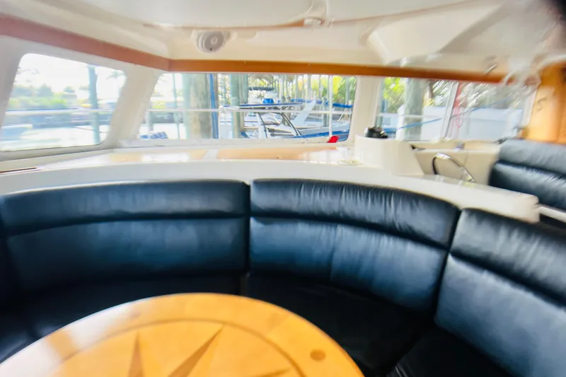 Slide: The Image of Luxurious interior of 2007 PDQ MV41 yacht with leather seating and wooden table. - 29