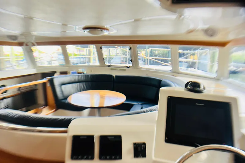 Slide: The Image of Interior of 2007 PDQ MV41 yacht with circular seating and navigation equipment. - 32
