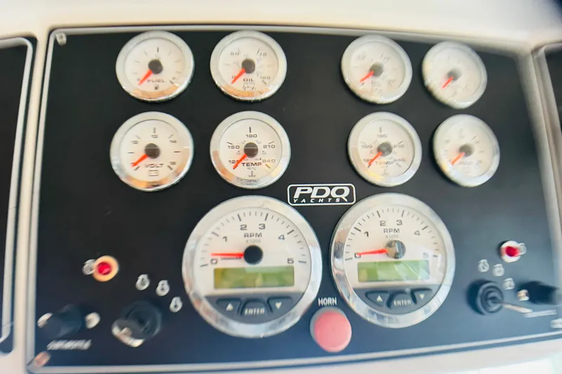 Slide: The Image of Dashboard of a 2007 PDQ MV41 yacht with various gauges and controls. - 34