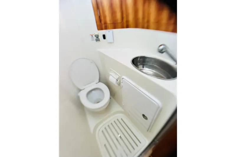 Slide: The Image of Compact bathroom in 2007 PDQ MV41 boat with toilet and sink. - 44