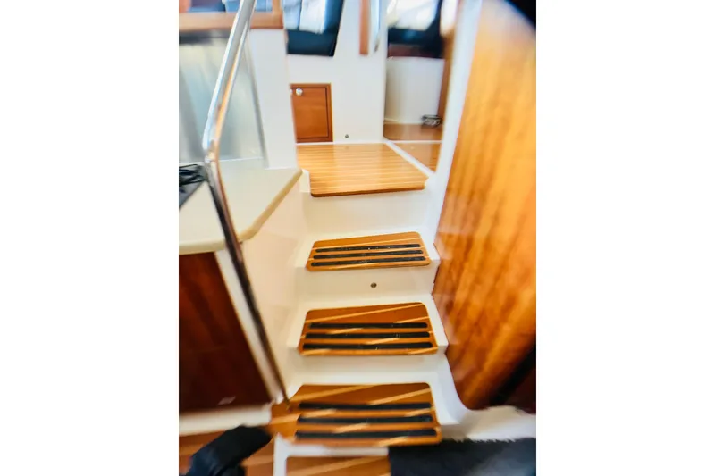 Slide: The Image of Interior stairs of 2007 PDQ MV41 boat with wooden steps and railing. - 50