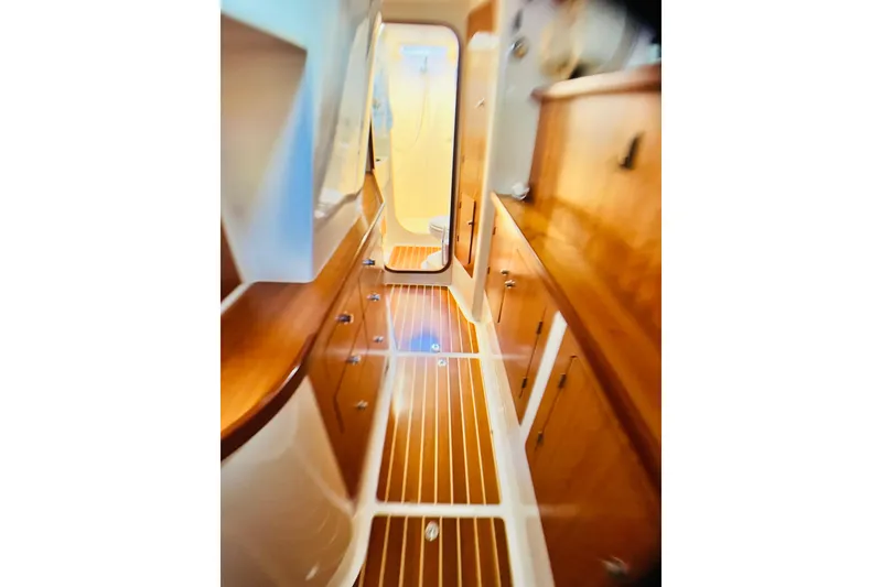 Slide: The Image of Interior of 2007 PDQ MV41 boat with wooden cabinetry and flooring. - 57