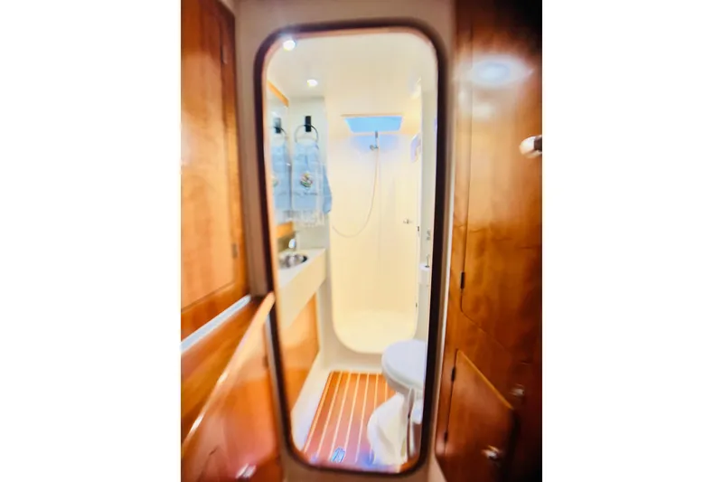 Slide: The Image of 2007 PDQ MV41 yacht bathroom with wooden accents and modern fixtures. - 62