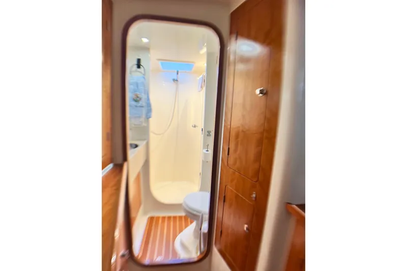 Slide: The Image of Compact bathroom interior of 2007 PDQ MV41 boat with wooden cabinetry. - 64