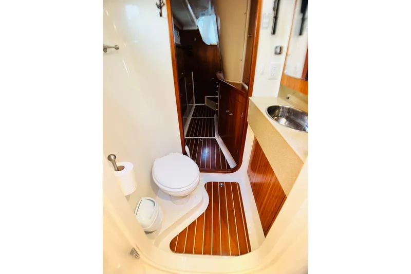 Slide: The Image of 2007 PDQ MV41 yacht bathroom with wood flooring and modern fixtures. - 68