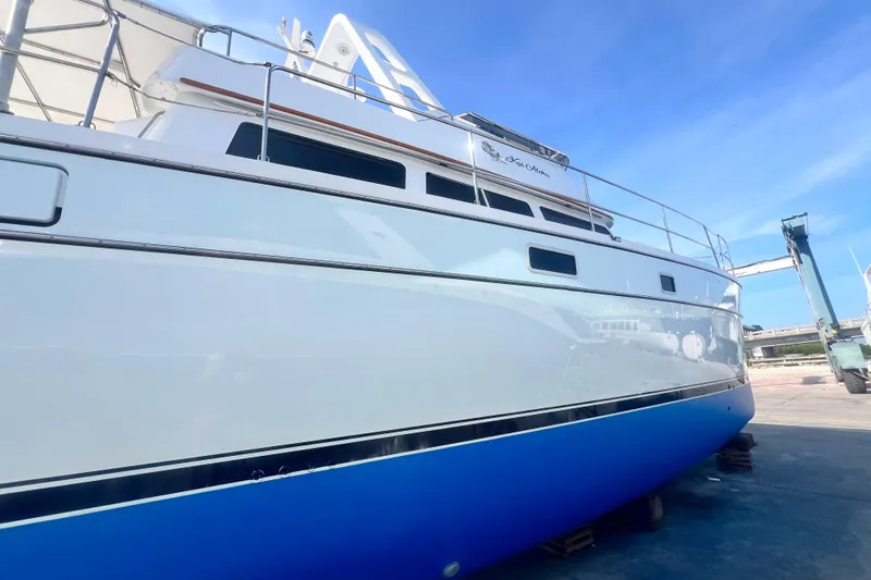 Slide: The Image of 2007 PDQ MV41 yacht on dry dock with blue hull and white upper structure. - 79