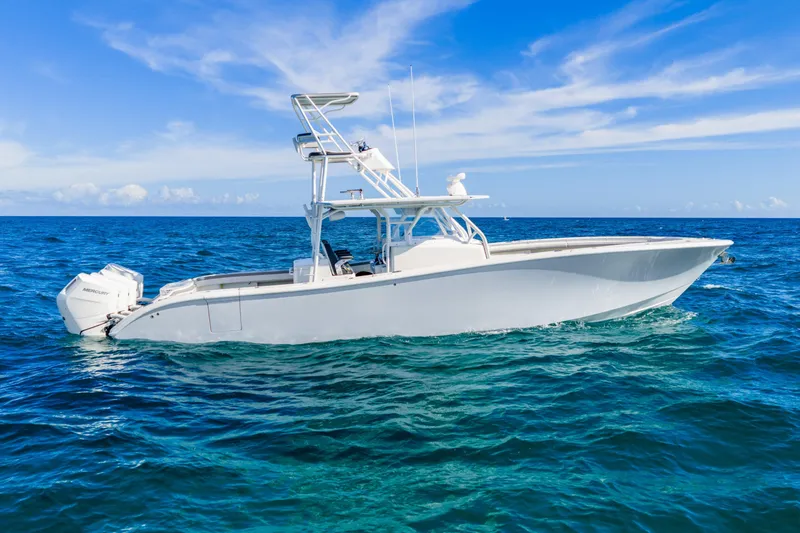 Slide: The Image of 2015 Yellowfin 42 Offshore boat on open ocean under clear blue sky. - 1