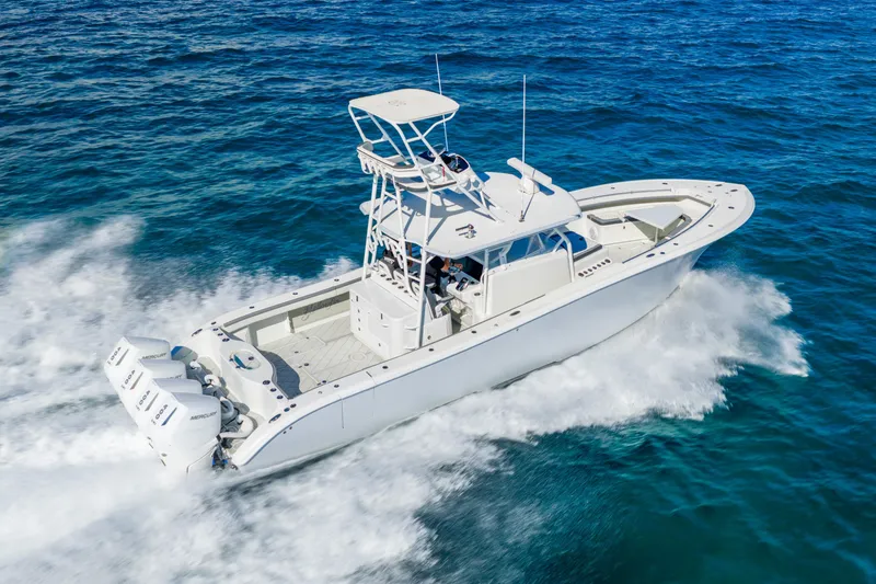 Slide: The Image of 2015 Yellowfin 42 Offshore boat cruising on open ocean waters. - 12