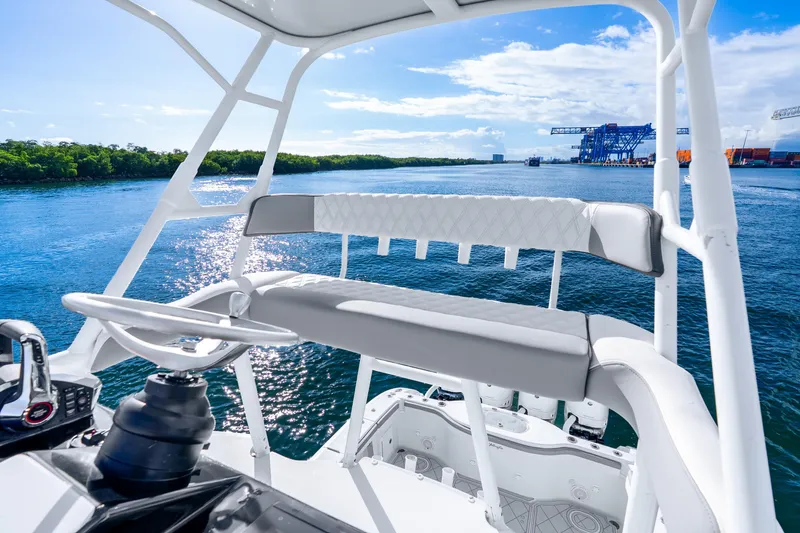 Slide: The Image of 2015 Yellowfin 42 Offshore boat helm with scenic waterway view. - 25