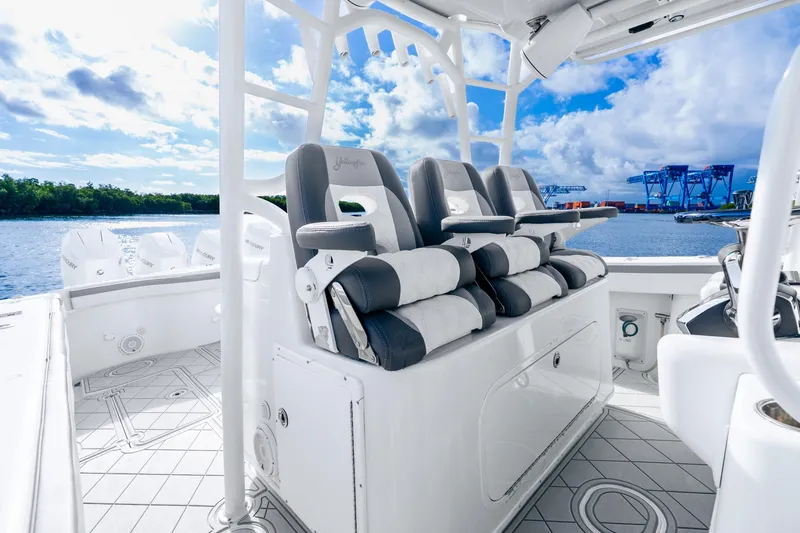Slide: The Image of 2015 Yellowfin 42 Offshore boat interior with luxury seating and ocean view. - 27