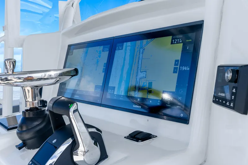 Slide: The Image of 2015 Yellowfin 42 Offshore helm with dual Garmin displays and controls. - 29