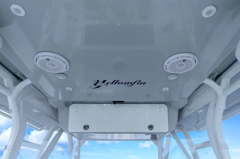 Slide: The Image of 2015 Yellowfin 42 Offshore boat interior ceiling with speakers and logo. - 39