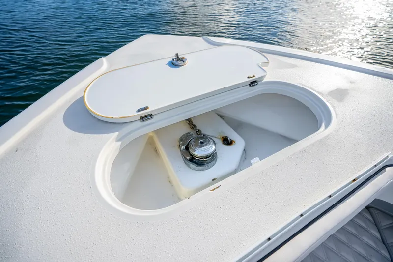 Slide: The Image of 2015 Yellowfin 42 Offshore boat anchor compartment on calm water. - 44