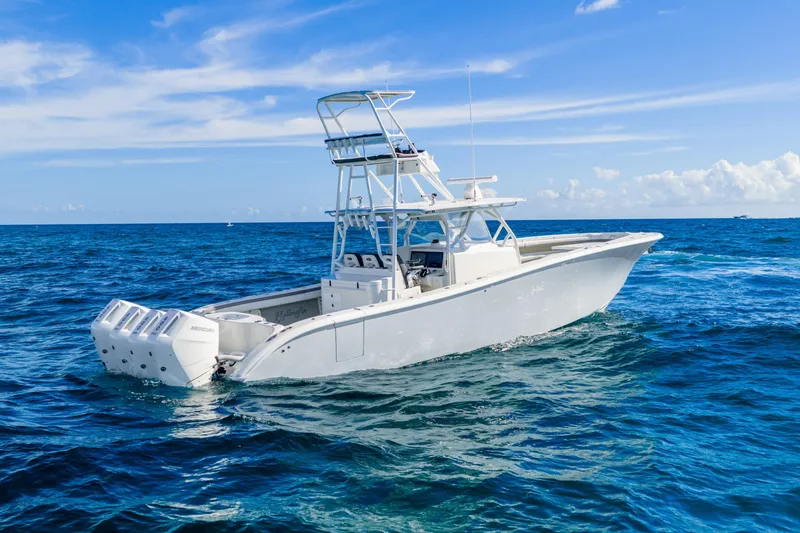 Slide: The Image of 2015 Yellowfin 42 Offshore boat on open ocean under clear blue sky. - 5